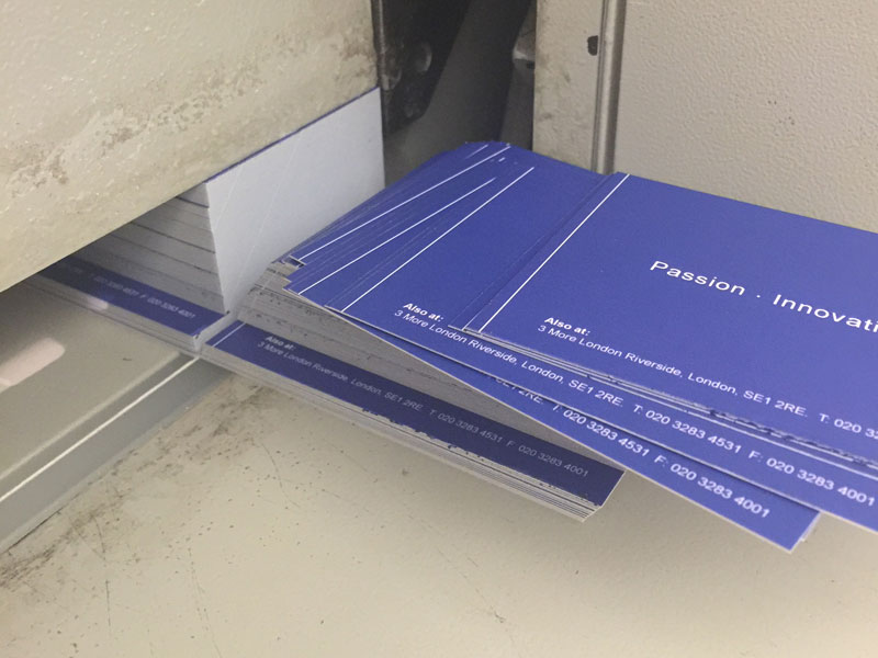 A stack of business cards printed by FV Repro
